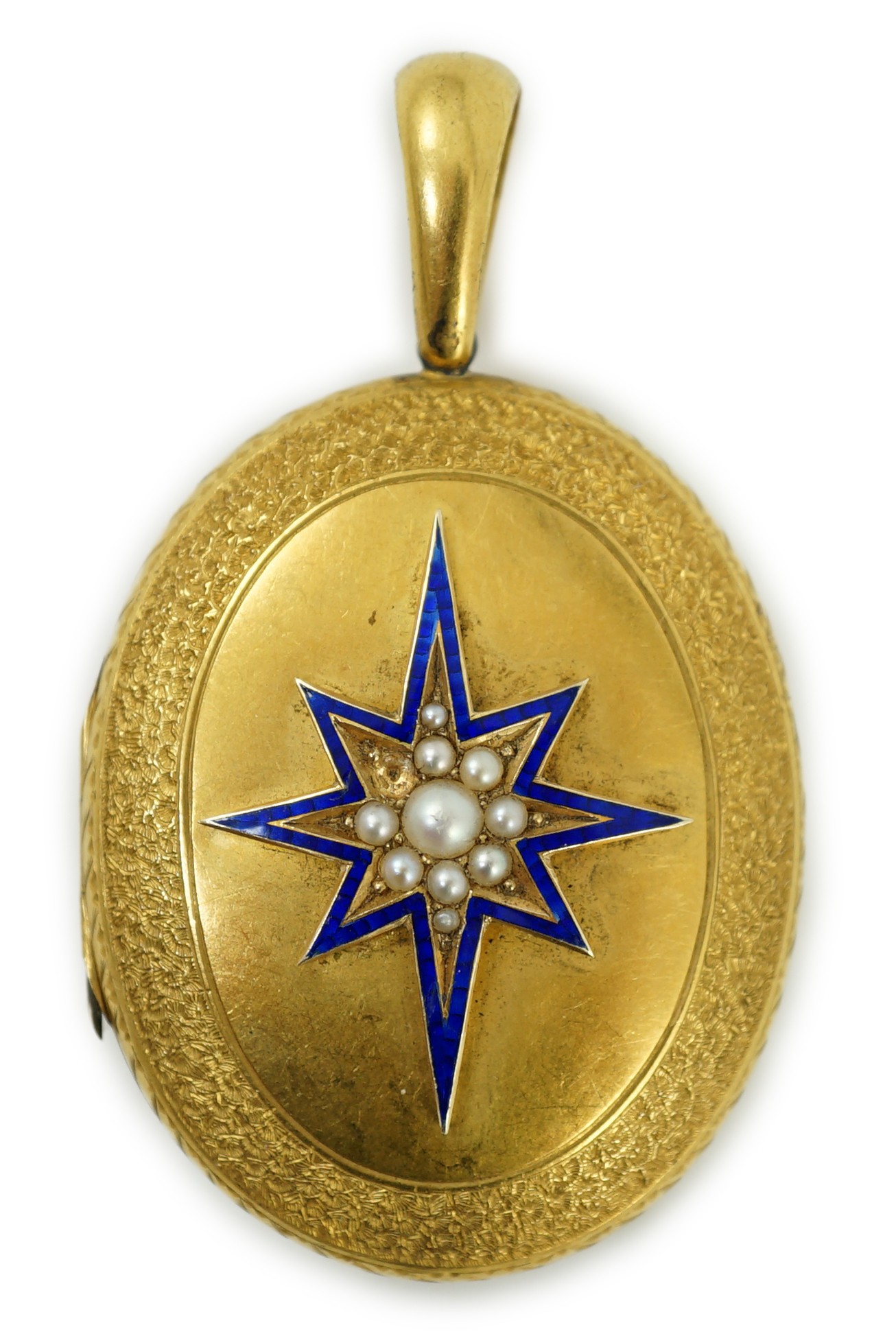 A Victorian engraved yellow metal, blue enamel and seed pearl set oval locket, 45mm, gross weight 21.2 grams.